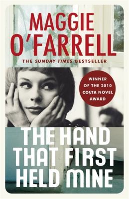Cover for The Hand That First Held Mine